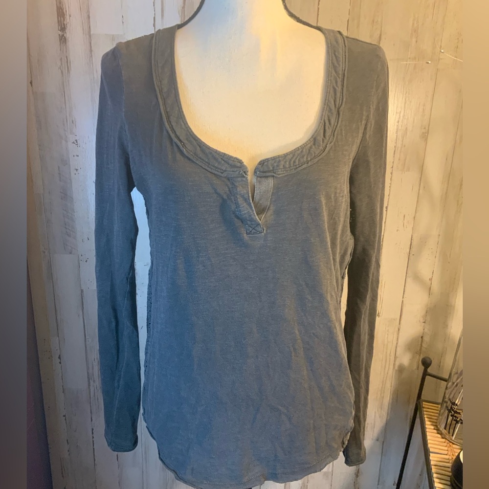 Free People long sleeve shirt with open lace designs on back. Size XS